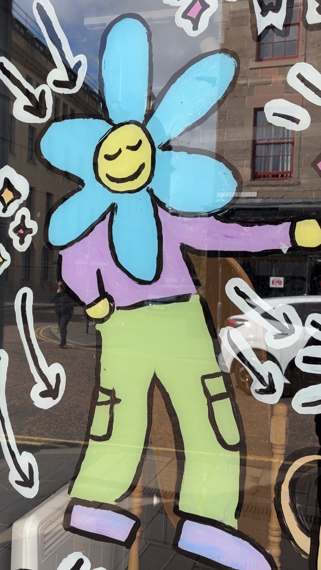 a drawing of a chill person with flower petals around their head